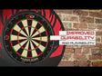 Tournament-size dartboard mounted on brick wall, full front view, highlighting thin wiring and enhanced durability for home or pro darts setup