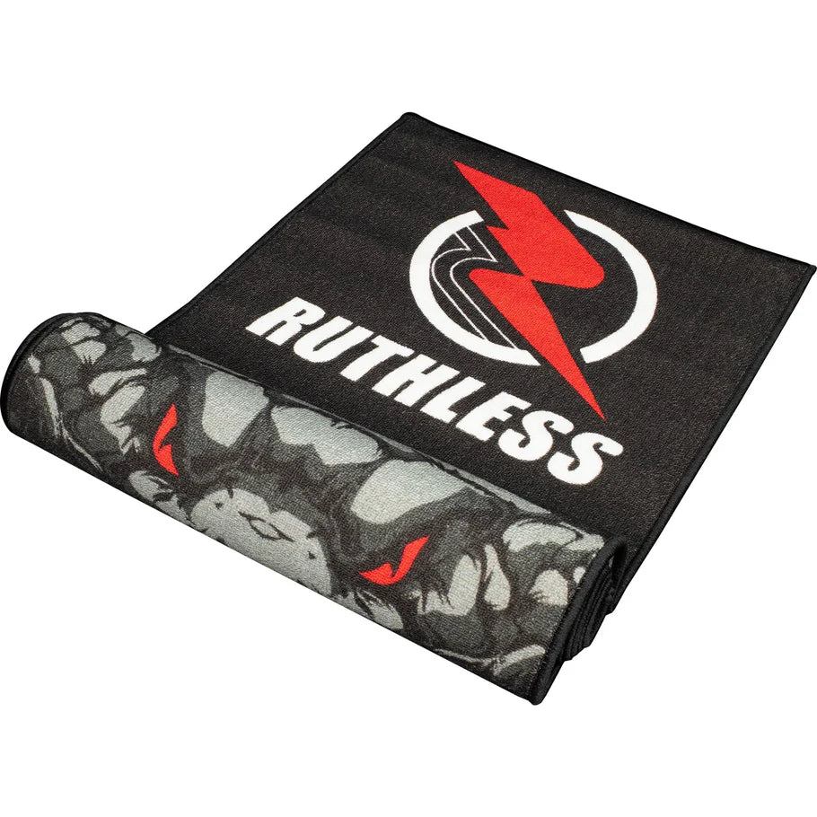 Angled view of black and grey cobra dart mat partially unrolled, featuring non-slip rubber backing and bold central cobra design for dart setup