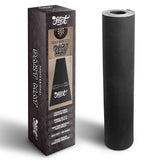 Heavy duty rubber dart mat rolled up beside packaging box, showing industrial rubber material for dartboard setup