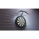 Dartboard mounted on wall with arc-shaped dartboard light installed overhead, showing bright even illumination for darts setup