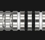 Macro close-up of 90% tungsten dart barrel highlighting precision grooves and grip rings, isolated on black background