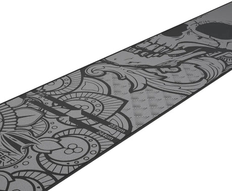 Angled view of ink design dart mat with tattoo patterns and measured throw lines for darts setup