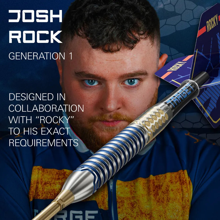 Angled close-up of Josh Rock G1 tungsten dart highlighting textured grip, blue rings, and hexagonal barrel design with player background