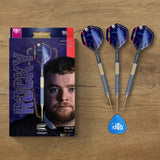 Top-down view of Josh Rock G1 90% tungsten steel tip darts with packaging, three darts arranged side by side, and included flight on wood background