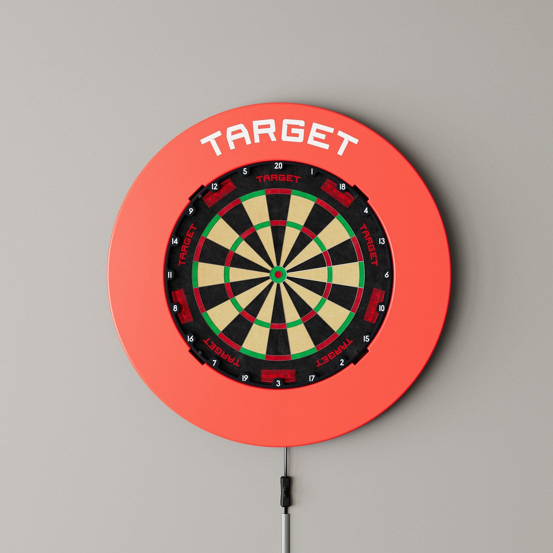 Target Notched Surround in red mounted on a wall with a dartboard