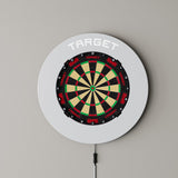 Target Notched Surround in grey mounted on a wall with a dartboard