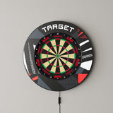 Target Patterned Notched Surround in black patterned mounted on a wall with a dartboard