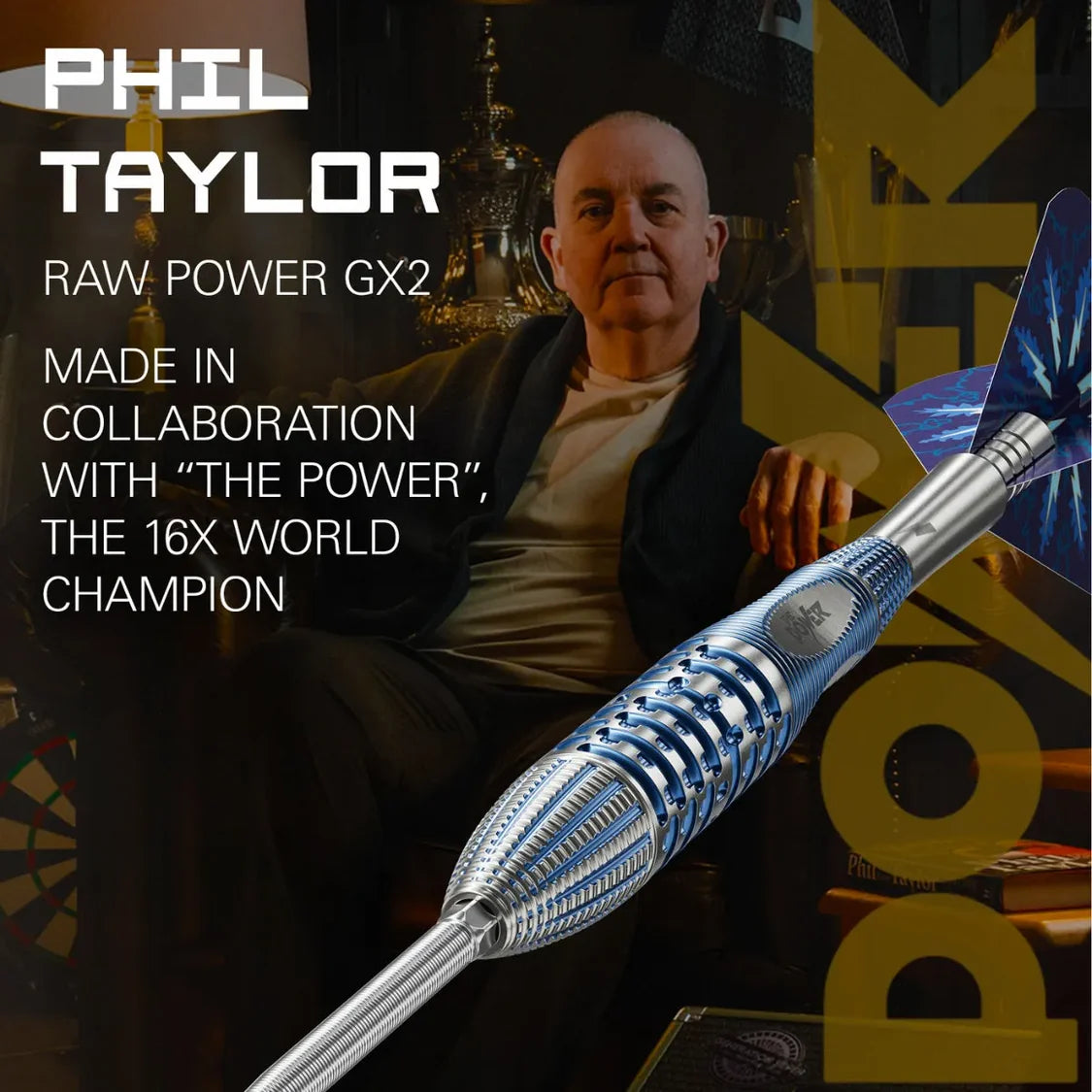 Angled close-up of Phil Taylor Gx2 tungsten dart highlighting grip texture and flight design, isolated over lifestyle background.