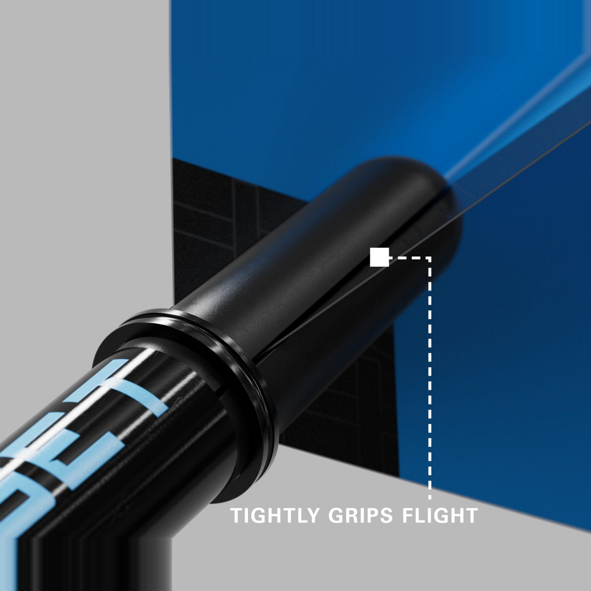 Close-up of a blue Pro Grip Tag shaft gripping a dart flight to prevent fallouts