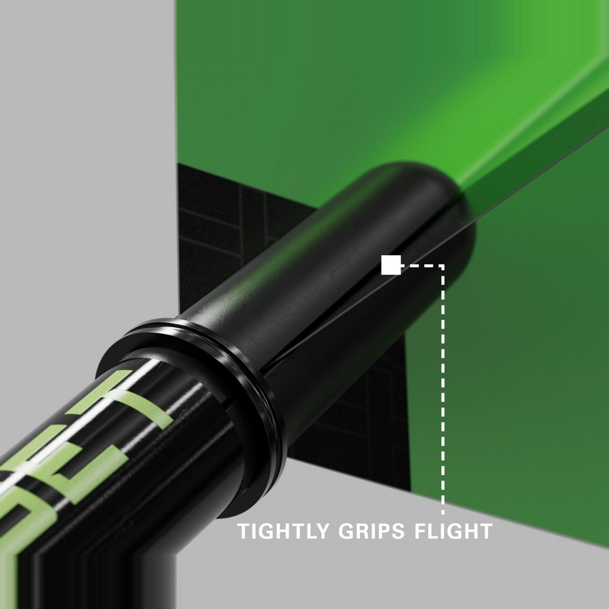 Close-up of a green Pro Grip Tag shaft gripping a dart flight to prevent fallouts