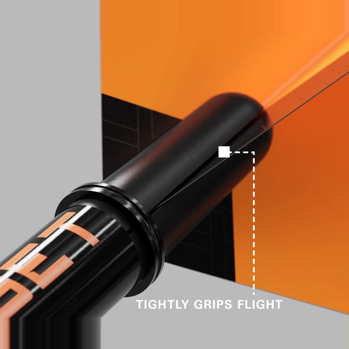 Close-up of an orange Pro Grip Tag shaft gripping a dart flight to prevent fallouts