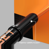 Close-up of an orange Pro Grip Tag shaft gripping a dart flight to prevent fallouts