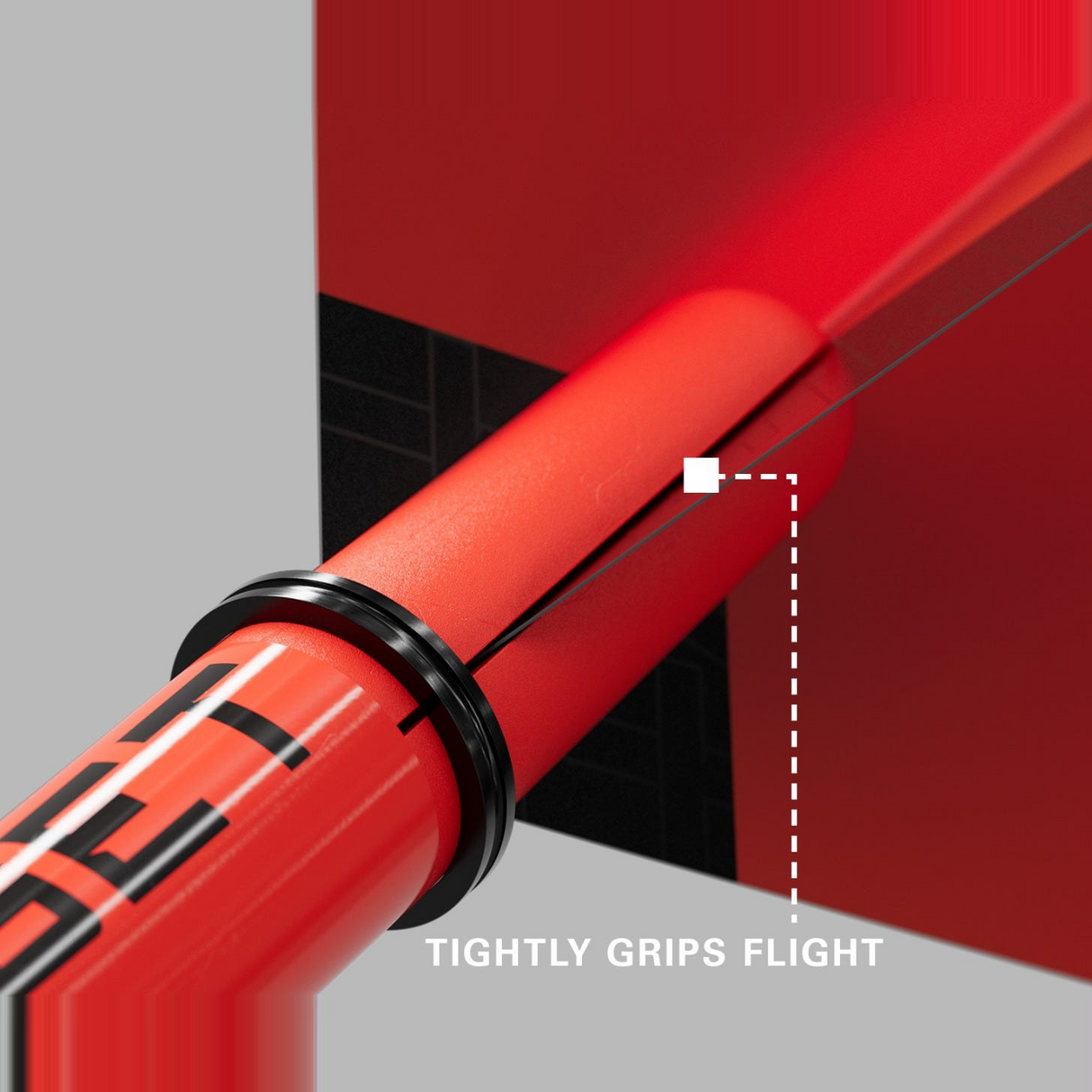 Close-up of a red Pro Grip Tag shaft gripping a dart flight to prevent fallouts