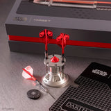 Angled close-up of Darth Vader limited edition tungsten darts in a metal stand, with red flights, one dart laid flat, accessories, and collectible packaging.