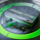 Top-down view of Star Wars Luke Skywalker dart set in box with three assembled green darts, spare points, keychain, and accessories displayed.