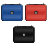 Three Takoma dart cases in black, blue, and red shown top-down, highlighting color variety and ribbed protective design for dart storage