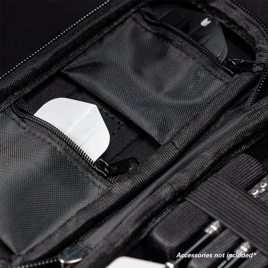 Close-up of darts case interior with zip pockets and elastic straps for organizing flights and darts accessories