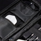 Close-up of darts case interior with zip pockets and elastic straps for organizing flights and darts accessories
