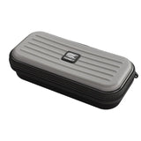 Grey darts case with hard shell, zipper closure and ridged top, angled view isolated on white for dart accessories storage