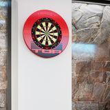 Target TOR Surround mounted on a wall with a dartboard