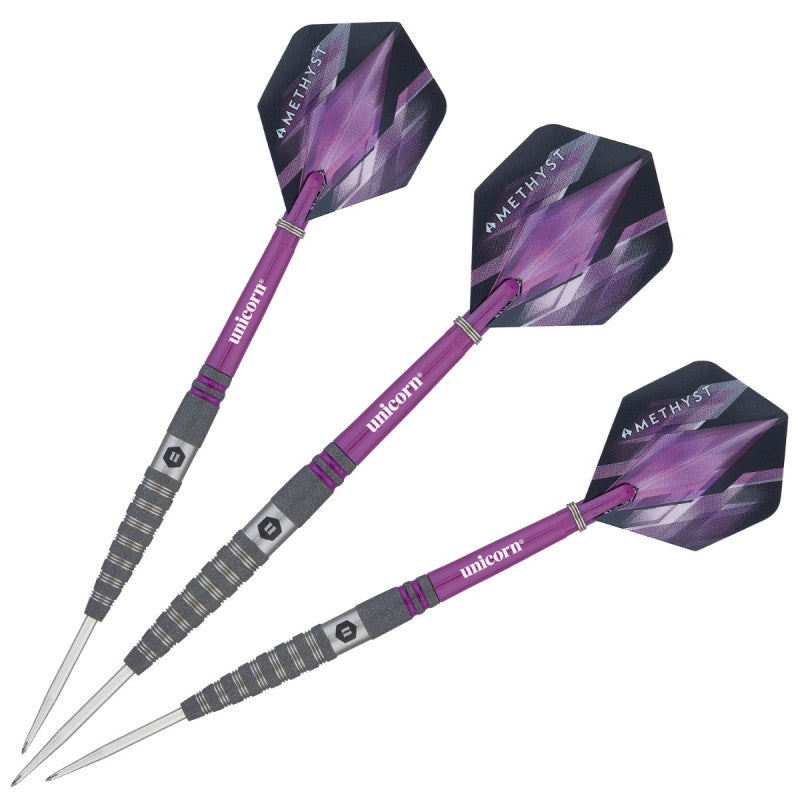 Three 90% tungsten darts with purple shafts, textured grip barrels, and amethyst pattern flights, isolated on white background