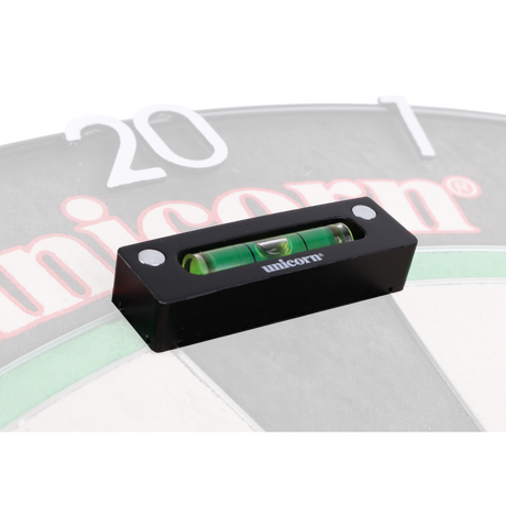 Close-up of dartboard leveller with spirit bubble, magnetically mounted on dartboard spider for precise setup