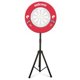 Portable dartboard tri-stand with red surround, dart illustrations, sturdy tripod legs, isolated on white background