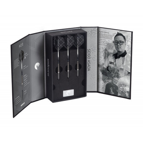 Seigo Asada Noir 90% tungsten darts set displayed in open box, featuring three darts with knurled barrels and stylish flights