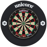 Full dartboard with black dartboard surround ring in top-down view, showing complete board and protective barrier for dart equipment buyers