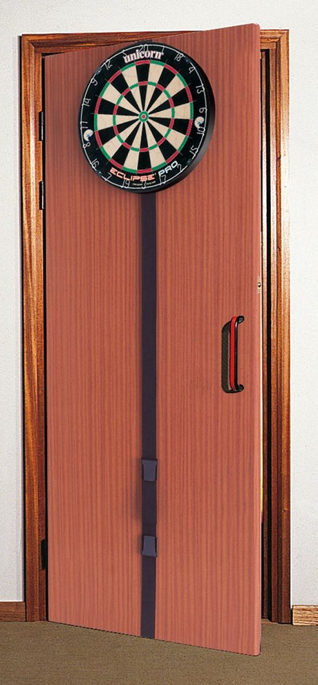 Portable dartboard mounted on a door using adjustable strap, full setup view, ideal for at-home darts practice