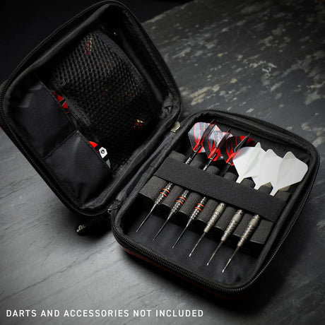 Angled view of open black darts case with elastic straps, mesh pocket, and dart storage, darts and flights shown for size reference