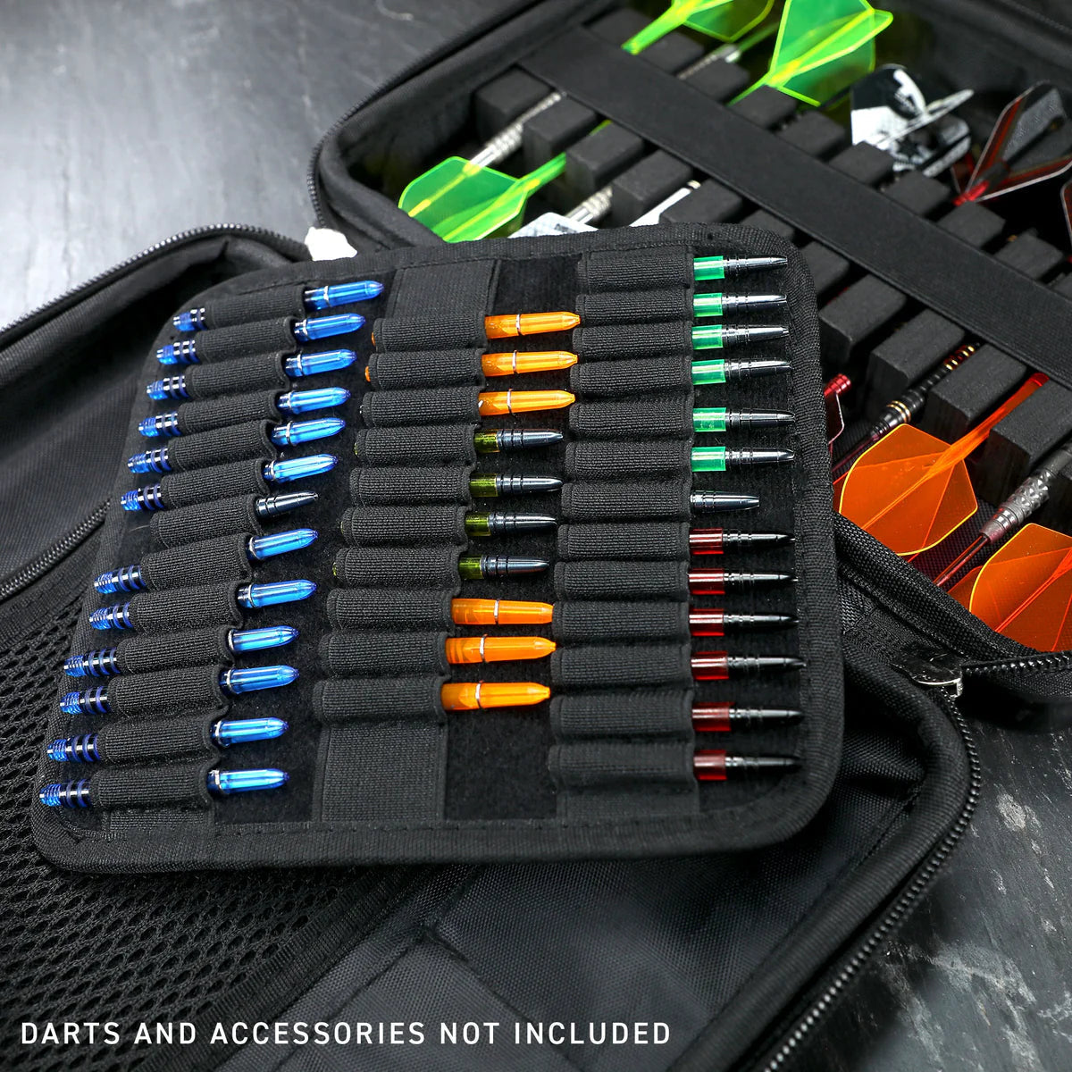 Angled close-up of spacious black darts case open with elastic slots and compartments for organized dart shafts and flights