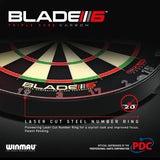 Angled close-up of Winmau Blade 6 Triple Core dartboard showing laser cut steel number ring and high-contrast scoring segments