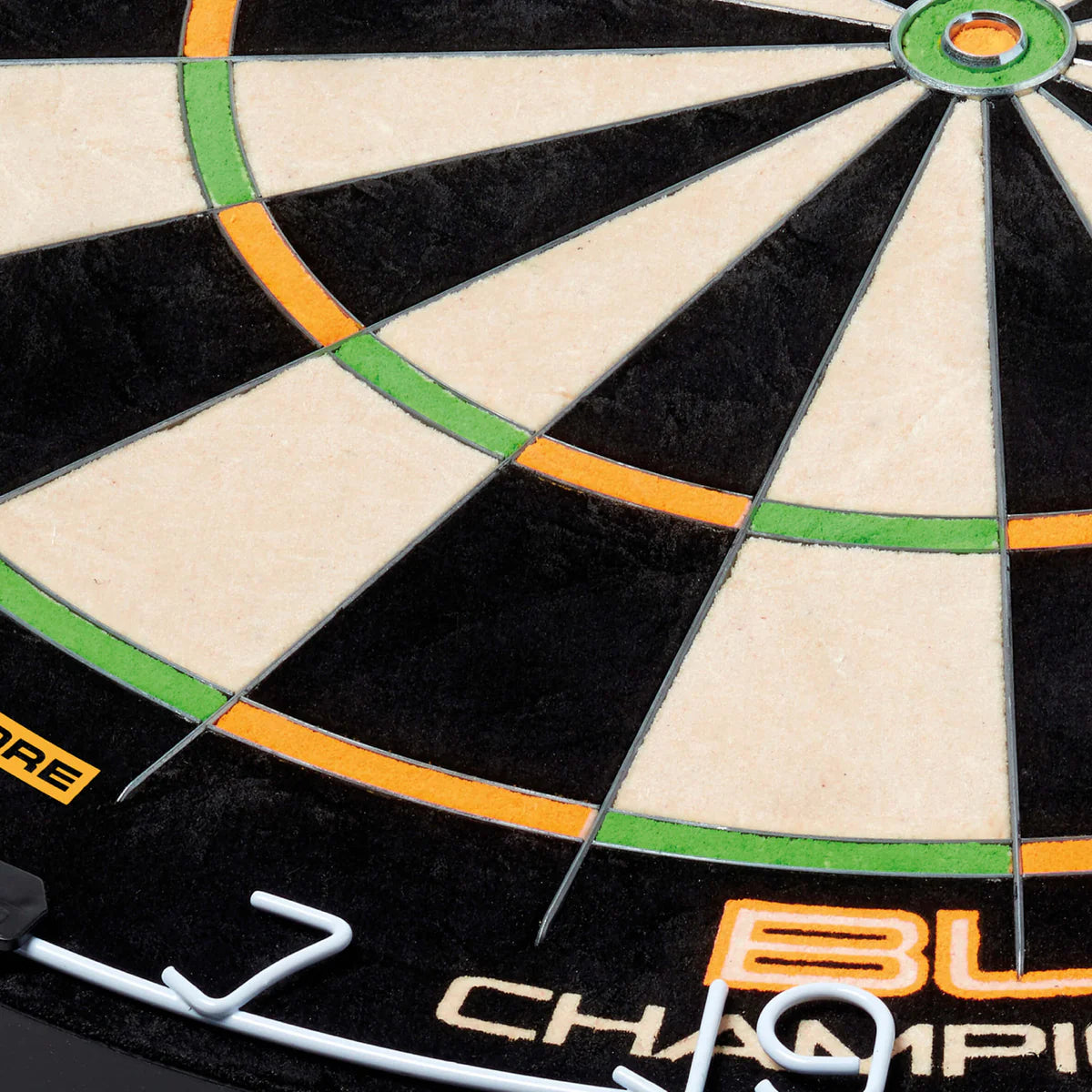 Close-up dartboard shot highlighting dual core segments, thin wire dividers, green and orange scoring areas, clear numbers