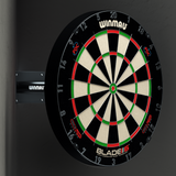 Angled view of dartboard mounted in corner with telescopic wall bracket, highlighting stable wall support for darts setup