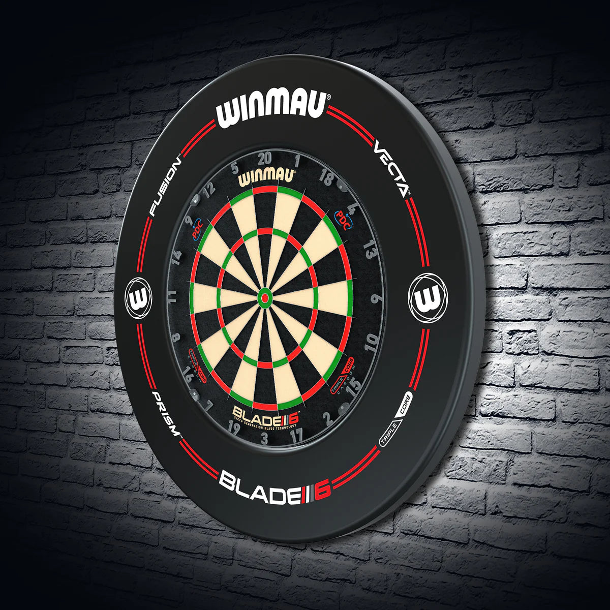 Angled shot of black dartboard surround and dartboard mounted on a brick wall, showing full protective ring and clear score zone details