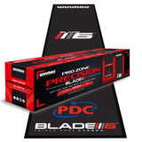 Angled view of soft feel dart mat with integrated oche and PDC, Blade 6 logos, product packaging shown on mat for darts setup