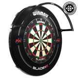 Angled view of Wispa dartboard light installed above dartboard, showing light arc and fixture for optimal board illumination